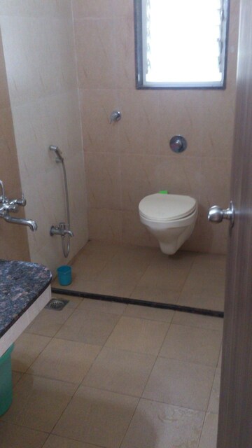 Bathroom in 4 BHK Apartment at Belvalkar Kalpak CHS, Dahanukar Colony – for Rent