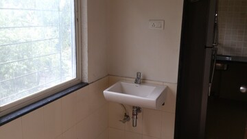 Bathroom in 4 BHK Apartment at Belvalkar Kalpak CHS, Dahanukar Colony – for Rent