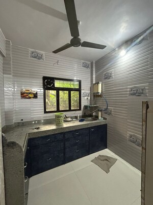 Kitchen in 3 BHK Apartment at Pushpanjali Heights, Owale – for Sale