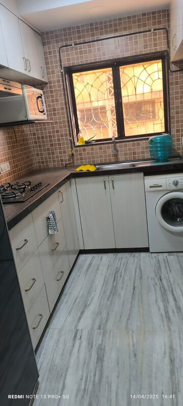 Kitchen in 2 BHK Apartment at Kumar Harshvardhan CHS, Andheri West – for Sale