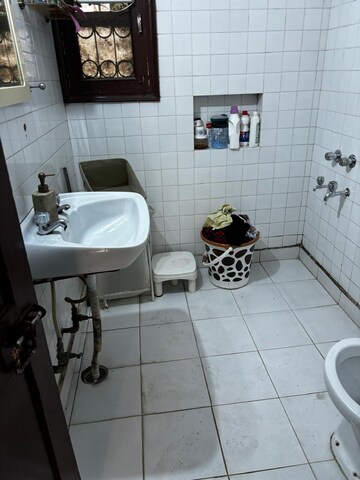 Bathroom in 2 BHK Apartment at Vasant Vihar – for Rent