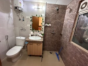 Bathroom in Studio Apartment at Nimbus The Golden Palm, Sector 168 – for Sale