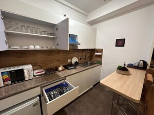Kitchen in Studio Apartment at Nimbus The Golden Palm, Sector 168 – for Sale
