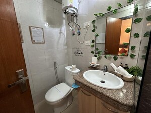 Bathroom in Studio Apartment at Nimbus The Golden Palm, Sector 168 – for Sale
