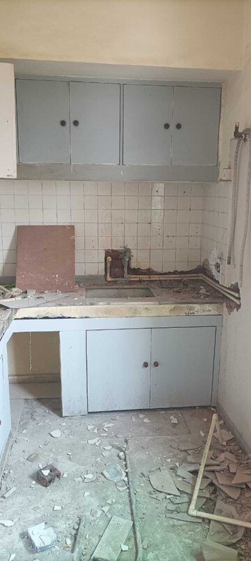 Kitchen in 3 BHK Apartment at RWA Jalvayu Vihar, Sector 25 – for Rent