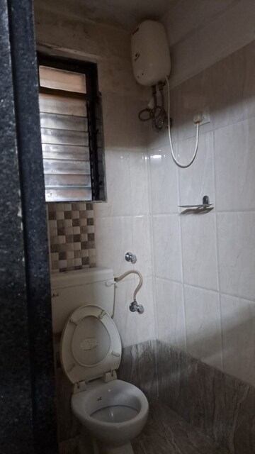 Bathroom in 2 BHK Apartment at Jasmine Tower, Vasant Vihar – for Rent