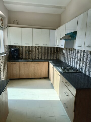 Kitchen in 4 BHK Builder Floor at Ansal API Esencia, Sector 67 – for Rent