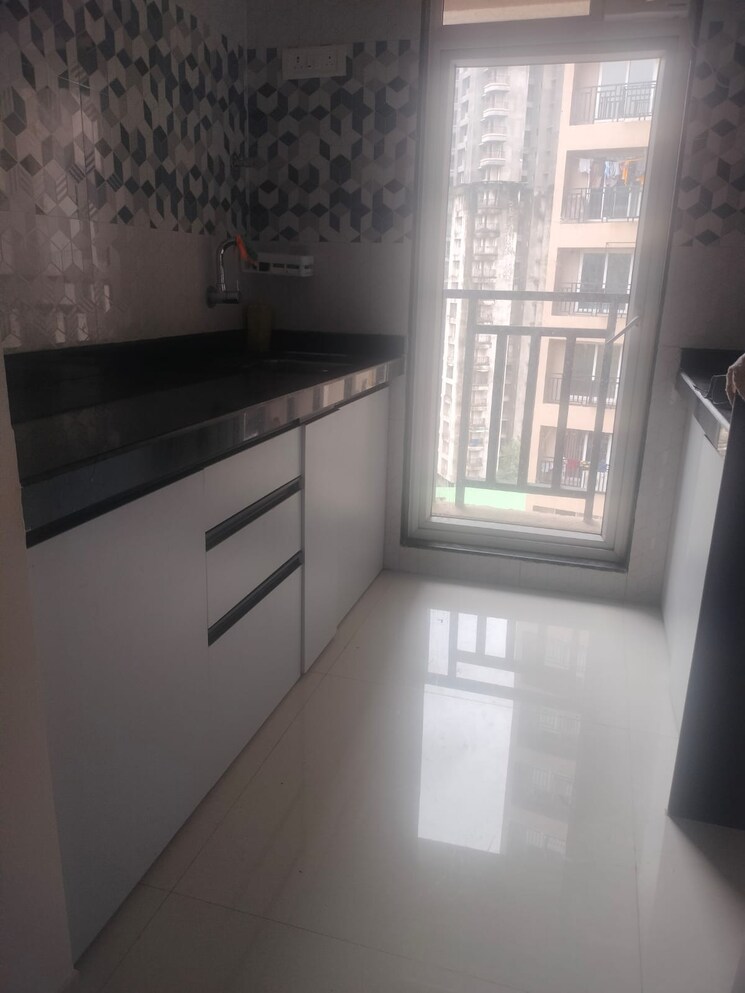 Kitchen, rosa-gardenia 1.5 Bedroom 555 Sq.Ft. Apartment In Ghodbunder Road Thane 9001943