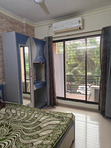 Bedroom in 2 BHK Apartment at Oracle Sapphire CHS, Nerul – for Rent