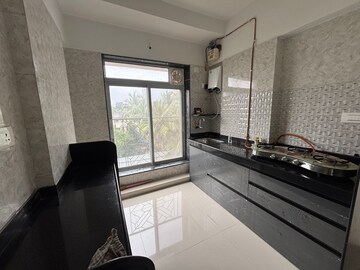 Kitchen in 2 BHK Apartment at Shivam Mrinal CHS, Kandivali East – for Rent