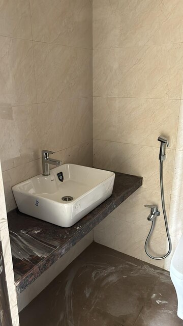 Bathroom in 1 BHK Apartment at Shree Tirupati STG Signature Residency, Patlipada – for Rent