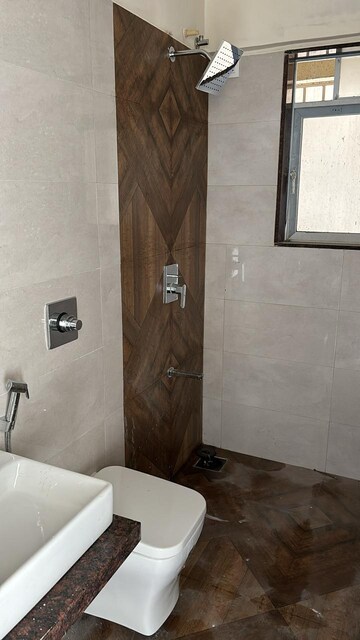 Bathroom in 1 BHK Apartment at Shree Tirupati STG Signature Residency, Patlipada – for Rent