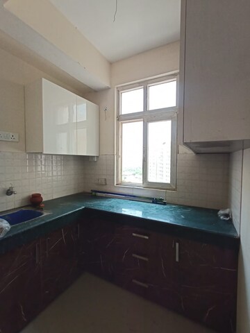 Kitchen in 1 BHK Apartment at Shree Vardhman Green Court, Sector 90 – for Sale