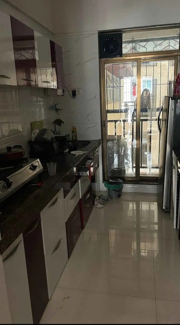 Kitchen in 2 BHK Apartment at Tharwani Rosewood Heights, Kharghar Sector 10 – for Rent