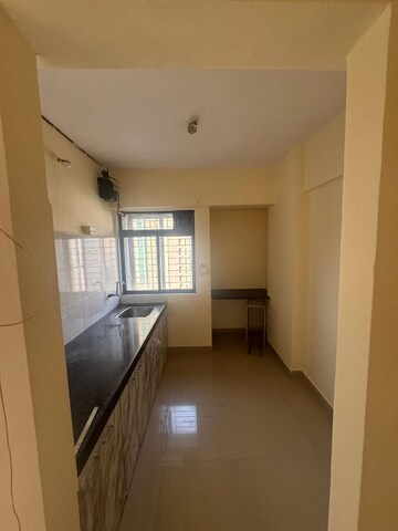 Kitchen in 2 BHK Apartment at Ram Pushpanjali Residency, Owale – for Rent