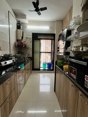 Kitchen in 2 BHK Apartment at New Brahmand Phase 7 CHS, Kiran Mill Colony – for Sale