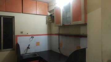 Kitchen in 1 BHK Apartment at Parijat Gardens Marigold CHS, Kasarvadavali – for Sale