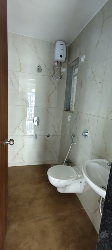 Bathroom in 1 BHK Apartment at Raunak Bliss, Ghodbunder Road – for Rent