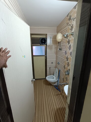 Bathroom in 2 BHK Apartment at Om Prabhu Manohar CHS, Seawoods Sector 50 – for Rent