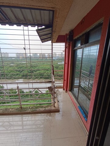 Balcony in 2 BHK Apartment at Om Prabhu Manohar CHS, Seawoods Sector 50 – for Rent