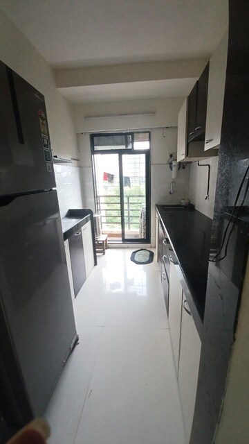 Kitchen in 1 BHK Apartment at RNA NG Canary, Mira Road – for Rent