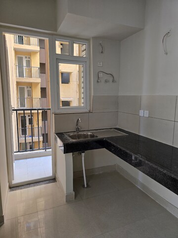 Kitchen in 3 BHK Apartment at Tata Eureka Park, Sector 150 – for Rent