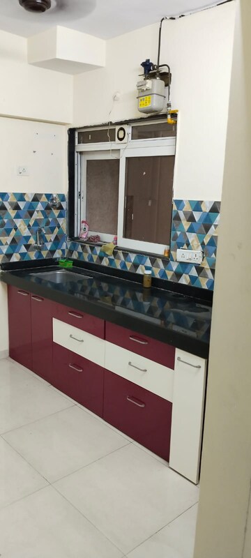Kitchen in 1 BHK Apartment at Cosmos Orchid, Ghodbunder Road – for Rent