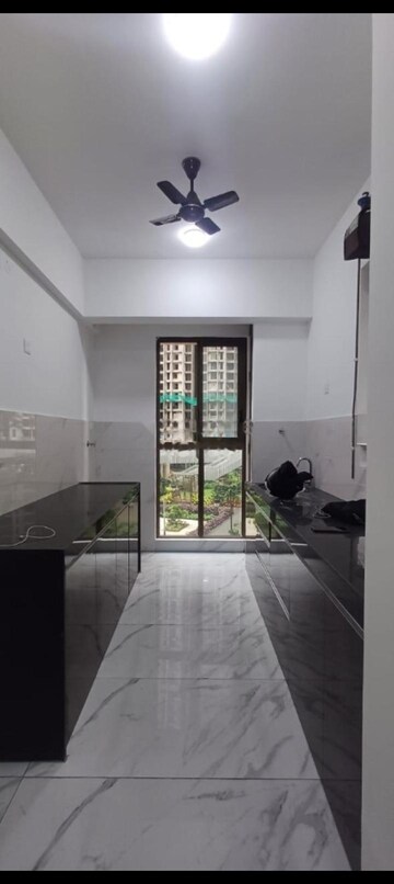 Kitchen in 2 BHK Apartment at Raymond Ten X Habitat, Pokhran Road No Two – for Rent