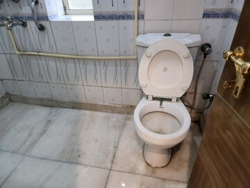 Bathroom in 2 BHK Apartment at RWA Qutab Enclave, Katwaria Sarai – for Rent