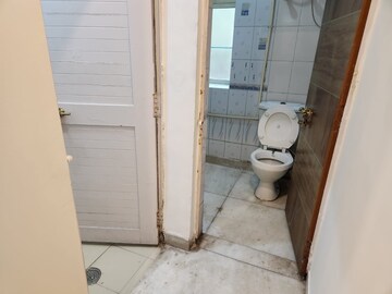 Bathroom in 2 BHK Apartment at RWA Qutab Enclave, Katwaria Sarai – for Rent