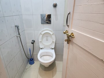 Bathroom in 2 BHK Apartment at RWA Qutab Enclave, Katwaria Sarai – for Rent