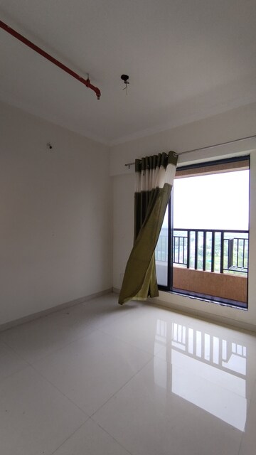 Room in 2 BHK Apartment at Raunak City Sector 4 D3, Kalyan West – for Rent