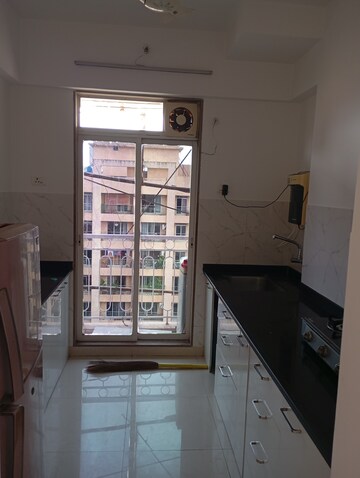 Kitchen in 2 BHK Apartment at Vijay Residency Phase III, Kavesar – for Rent