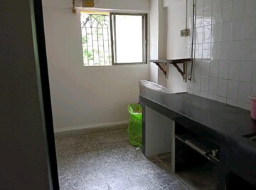 Kitchen in 2 BHK Apartment at Sai Marigold CHSL, Kavesar – for Rent