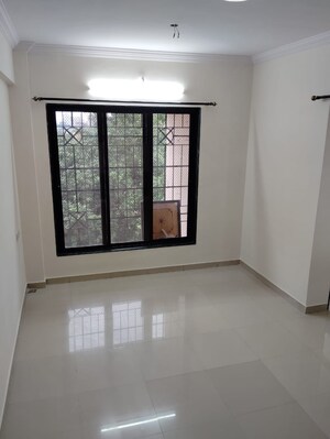 Room in 1 BHK Apartment at Puraniks Kavya Dhara CHS, Dhokali – for Sale