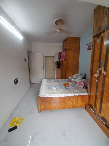 Master Bedroom in 1 BHK Apartment at Divya Srushti CHS, Kandivali West – for Rent