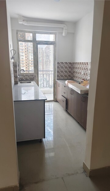 Kitchen in 3 BHK Apartment at Aims Greens Avenue, Sector 4 Greater Noida – for Rent