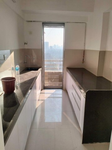 Kitchen in 2 BHK Apartment at Unique Poonam Estate Cluster 2, Mira Road – for Rent