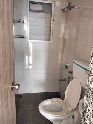 Bathroom in 2 BHK Apartment at Unique Poonam Estate Cluster 2, Mira Road – for Rent