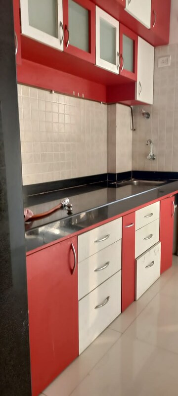 Kitchen in 1 BHK Apartment at Cosmos Orchid, Ghodbunder Road – for Sale