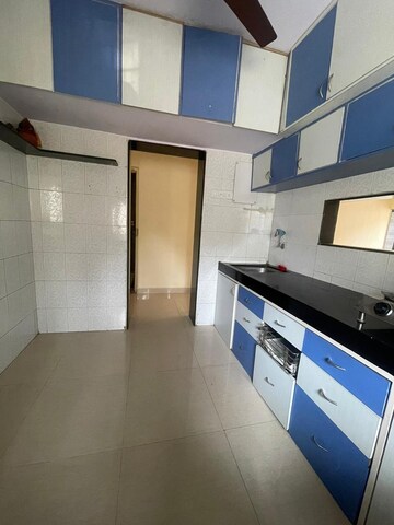 Kitchen in 2 BHK Apartment at Happy Valley, Manpada – for Sale
