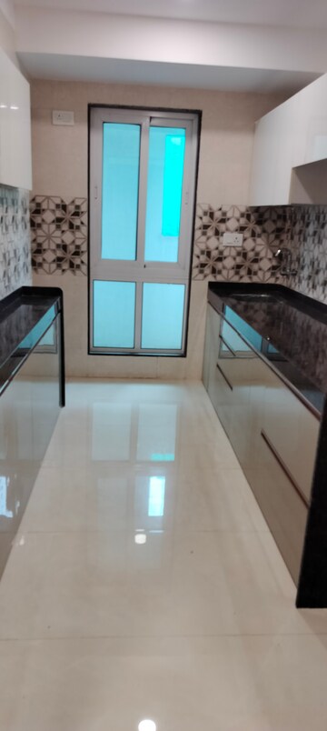 Kitchen in 2 BHK Apartment at Relliance Lashkaria Solitaire, Andheri West – for Sale