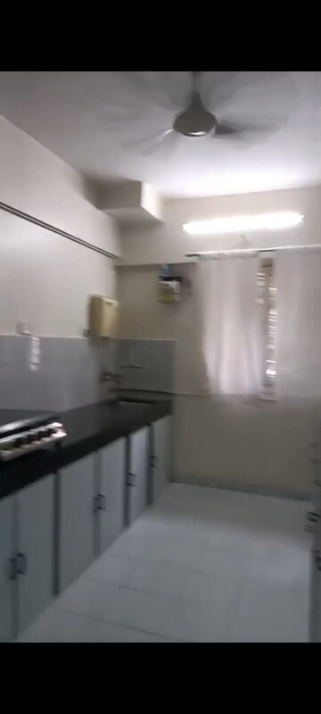 Kitchen in 2 BHK Apartment at Crystal Garden Estate CHS, Manpada – for Sale