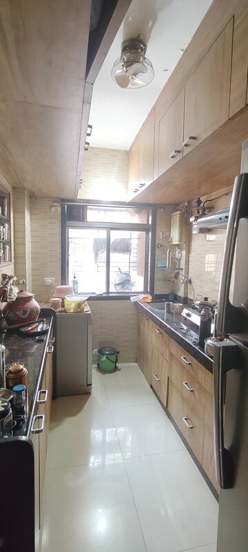 Kitchen in 2 BHK Apartment at Dheeraj Uphar CHS. LTD., Malad East – for Rent