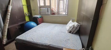 Bedroom in 2 BHK Apartment at Dheeraj Uphar CHS. LTD., Malad East – for Rent