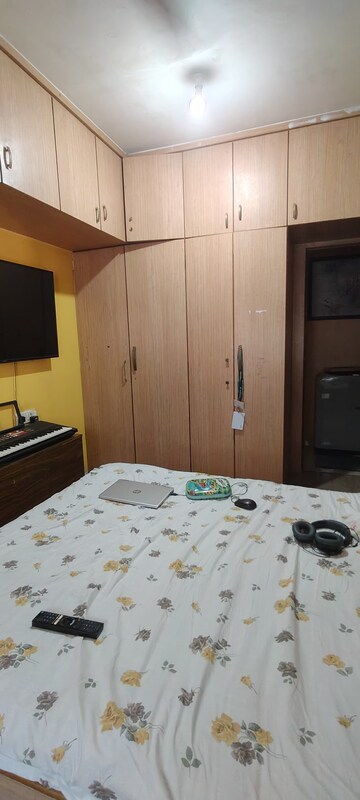Bedroom in 2 BHK Apartment at Dheeraj Uphar CHS. LTD., Malad East – for Rent