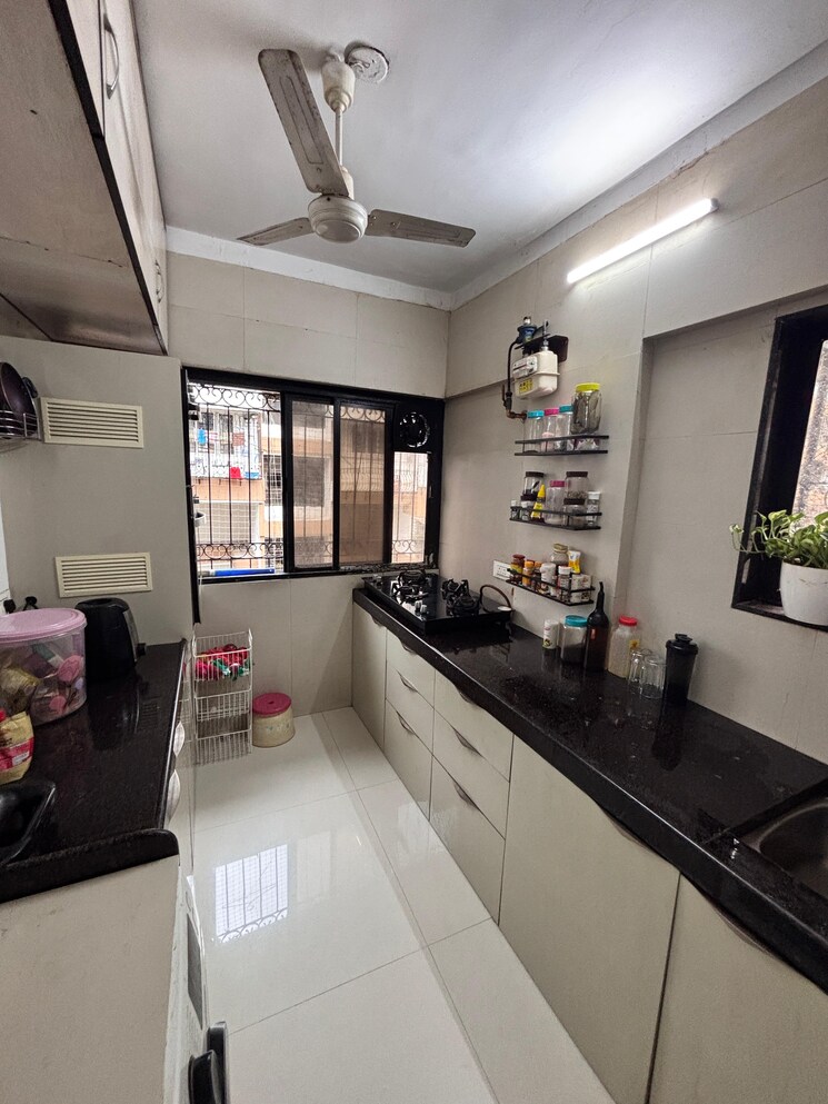 Kitchen, sky-anchorage 3 Bedroom 1000 Sq.Ft. Apartment In Versova Mumbai 9016934