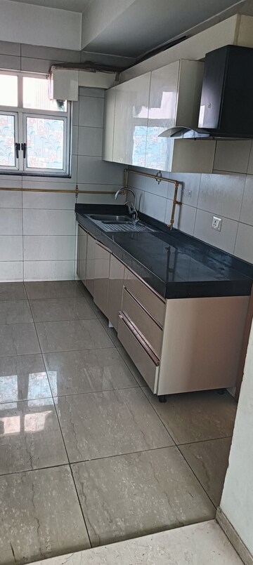 Kitchen in 3 BHK Apartment at Adani M2K Oyster Grande, Sector 102 – for Sale