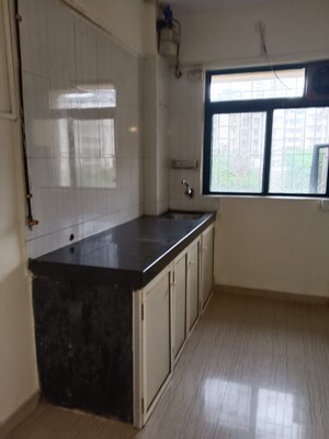 Kitchen in 1 BHK Apartment at JVM Aroma, Kasarvadavali – for Sale