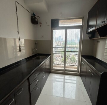 Kitchen in 2 BHK Apartment at Vijay Galaxy, Waghbil – for Sale